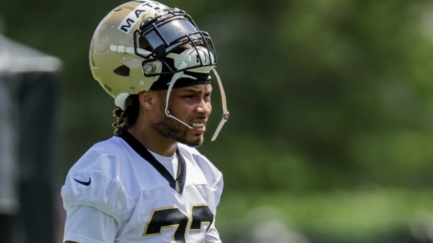 New Orleans Saints safety Tyrann Mathieu wore Air Jordan 1 Mid 'Patent Black White Gold' sneakers during an NFL photo shoot.